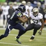 Seattle Seahawks running back Marshawn Lynch (24) runs against the New Orleans Saints in the first half of an NFL football game, Monday, Dec. 2, 2013, in Seattle. (AP Photo/Elaine Thompson)