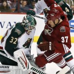 Phoenix Coyotes' Raffi Torres (37) collides with Minnesota Wild's Niklas Backstrom (32), of Finland, during the first period in an NHL hockey game, Thursday, Feb. 28, 2013, in Glendale, Ariz. (AP Photo/Ross D. Franklin)