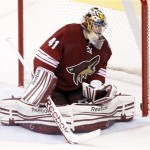 Phoenix Coyotes goalie Mike Smith looks in the net for the puck after Tampa Bay Lightning right winger Steve Downie scored a goal against Smith in the second period of an NHL hockey game on Saturday, Jan. 21, 2012, in Glendale, Ariz. (AP Photo/Paul Connors)