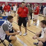 USA Basketball men's national team head coach Mike Krzyzewski, center, talks with Chandler Parsons, left, of the Houston Rockets and Gordon Hayward, of the Utah Jazz, at the end of mini camp practice, Monday, July 22, 2013, in Las Vegas. After leading Team USA to two straight Olympic gold medals, Krzyzewski will return to lead the Americans at the Rio Olympics in 2016 and will join Henry Iba as the only coaches in U.S. history to coach in three Olympics. (AP Photo/Julie Jacobson)