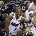 The Miami Heat's Chris Bosh (1) celebrates after the second half in Game 7 of the NBA basketball championship against the San Antonio Spurs, Friday, June 21, 2013, in Miami. The Miami Heat defeated the San Antonio Spurs 95-88 to win their second straight NBA championship.(AP Photo/Steve Mitchell, Pool)