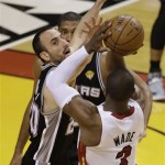 Miami Heat's Dwyane Wade (3) shoots against San Antonio Spurs' Manu Ginobili (20) of Argentina during the first half in Game 7 of the NBA basketball championships, Thursday, June 20, 2013, in Miami. (AP Photo/Wilfredo Lee)