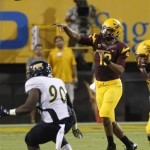 Arizona State Sun Devils quarterback Michael Eubank, right, throws for a first down against Northern Arizona during the second half of a football game on Thursday, Aug. 30 2012, in Tempe, Ariz. (AP Photo/Rick Scuteri)