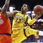Marquette guard Trent Lockett (13) shoots past Syracuse forward Rakeem Christmas (25) during the second half of the East Regional final in the NCAA men's college basketball tournament, Saturday, March 30, 2013, in Washington. (AP Photo/Mark Tenally)