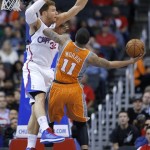 Phoenix Suns' Markieff Morris, right, works against Los Angeles Clippers' Blake Griffin in the first half of an NBA basketball game in Los Angeles, Saturday, Dec. 8, 2012. (AP Photo/Jae C. Hong)
