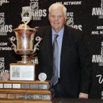 St. Louis Blues coach Ken Hitchcock poses with the Jack Adams trophy after winning the award for coach of the year, during the NHL Awards, Wednesday, June 20, 2012, in Las Vegas. (AP Photo/Julie Jacobson)