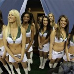 Some New York Jets cheerleaders watch the festivities during media day for the NFL Super Bowl XLVIII football game Tuesday, Jan. 28, 2014, in Newark, N.J. (AP Photo/Charlie Riedel)