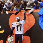  Fans congratulate San Diego Chargers quarterback Philip Rivers (17) after a 27-10 win over the Cincinnati Bengals in an NFL wild-card playoff football game on Sunday, Jan. 5, 2014, in Cincinnati. (AP Photo/Tom Uhlman)