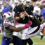 Arizona Cardinals quarterback Kevin Kolb (4) is sacked by Buffalo Bills defensive end Mario Williams (94) during the second half of an NFL football game on Sunday, Oct. 14, 2012, in Glendale, Ariz. (AP Photo/Rick Scuteri)