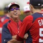 Washington Nationals manager Davey Johnson, left, laughs as he talks with pitcher Christian Garcia during a spring training baseball workout Thursday, Feb. 14, 2013, in Viera, Fla. (AP Photo/David J. Phillip)