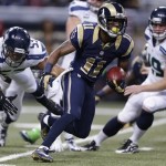 St. Louis Rams wide receiver Tavon Austin (11) runs on a punt return against Seattle Seahawks outside linebacker Malcolm Smith (53) during the first half of an NFL football game, Monday, Oct. 28, 2013, in St. Louis. (AP Photo/Michael Conroy)