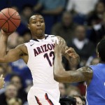 Arizona guard Lamont Jones looks to pass as Memphis forward Tarik Black defends in the first half of a West Regional NCAA tournament second round college basketball game, Friday, March 18, 2011 in Tulsa, Okla. (AP Photo/Charlie Riedel)