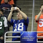 Fans take pictures during media day for the NFL Super Bowl XLVIII football game Tuesday, Jan. 28, 2014, in Newark, N.J. (AP Photo/Jeff Roberson)