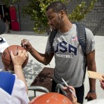 John Wall of the Washington Wizards signs autographs for fans after a USA Basketball mini camp practice, Monday, July 22, 2013, in Las Vegas. Twenty-eight of the best young players in the country are in Las Vegas for four days of workouts that essentially mark the kickoff of 2016 Olympic preparations. (AP Photo/Julie Jacobson)