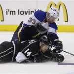 St. Louis Blues' Jordan Leopold, top, tries to score against Los Angeles Kings' Justin Williams during the third period in Game 3 of a first-round NHL hockey Stanley Cup playoff series in Los Angeles, Saturday, May 4, 2013. The Kings won 1-0. (AP Photo/Jae C. Hong)