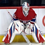Montreal Canadiens goalie Peter Budaj warms up before the season opener against the Toronto Maple Leafs in an NHL hockey game on Tuesday, October 1, 2013, in Montreal. (AP Photo/The Canadian Press, Ryan Remiorz)