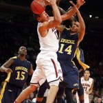  Arizona's Aaron Gordon, left, has a rebound knocked away from him by Drexel's Dartaye Ruffin, behind and Damion Lee (14) during the first half of an NCAA college basketball game in the semifinals of the NIT Season Tip-off tournament Wednesday, Nov. 27, 2013, in New York. (AP Photo/Jason DeCrow)