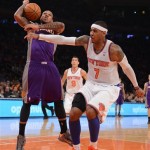 New York Knicks' Carmelo Anthony (7) knocks the ball out of the hands of the Phoenix Suns' Shannon Brown in the third quarter of the NBA basketball game at Madison Square Garden in New York, Sunday, Dec. 2, 2012. The Knicks won 106-99. (AP Photo/Henny Ray Abrams)