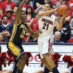 Arizona's Brandon Ashley (21) looks to pass the ball around Southern Mississippi's Deon Edwin (15) during the first half of an NCAA college basketball game at McKale Center in Tucson, Ariz., Tuesday, Dec. 4, 2012. (AP Photo/Wily Low)