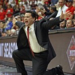  Arizona head coach Sean Miller signals his players against Rhode Island in the first half of an NCAA college basketball game, Tuesday, Nov. 19, 2013 in Tucson, Ariz. This is in the second round of the NIT. (AP Photo/Wily Low)