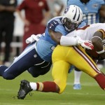 Washington Redskins wide receiver Leonard Hankerson (85) is stopped by Tennessee Titans linebacker Zach Brown, top, in the first quarter of a preseason NFL football game on Thursday, Aug. 8, 2013, in Nashville, Tenn. (AP Photo/Wade Payne)