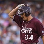 Mississippi State's Hunter Renfroe holds his head after flying out to left field against UCLA in the fourth inning of Game 2 in their NCAA College World Series baseball finals, Tuesday, June 25, 2013, in Omaha, Neb. (AP Photo/Ted Kirk)