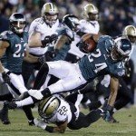 Philadelphia Eagles' Bradley Fletcher (24) is tackled by New Orleans Saints' Mark Ingram (22) after Fletcher intercepted a Saints' pass during the first half of an NFL wild-card playoff football game, Saturday, Jan. 4, 2014, in Philadelphia. (AP Photo/Matt Rourke)