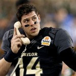 Baylor quarterback Bryce Petty talks to his coaches during the first half of the Fiesta Bowl NCAA college football game against Central Florida, Wednesday, Jan. 1, 2014, in Glendale, Ariz. (AP Photo/Ross D. Franklin)
