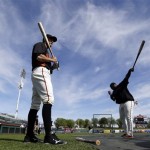 San Francisco Giants' Hunter Pence, left, and Pablo Sandoval prepare for batting practice before an exhibition spring training baseball game against the Texas Rangers on Friday, March 15, 2013 in Scottsdale, Ariz. (AP Photo/Marcio Jose Sanchez)