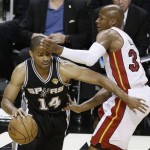San Antonio Spurs point guard Gary Neal (14) moves the ball against Miami Heat shooting guard Ray Allen (34) maybe during the first half of Game 6 of the NBA Finals basketball game, Tuesday, June 18, 2013 in Miami. (AP Photo/Wilfredo Lee)