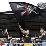 
Pittsburgh Pirates fans wave Jolly Roger flags during the introductions of the Pittsburgh Pirates before Game 4 of a National League baseball division series against the St. Louis Cardinals on Monday, Oct. 7, 2013, in Pittsburgh. (AP Photo/Keith Srakocic)