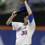 New York Mets starting pitcher Shaun Marcum wipes his face during the first inning of the baseball game against the Arizona Diamondbacks at Citi Field, Monday, July 1, 2013, in New York. (AP Photo/Seth Wenig)