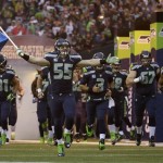  Seattle Seahawks' Heath Farwell leads his team onto the field during the first half of the NFL football NFC Championship game against the San Francisco 49ers Sunday, Jan. 19, 2014, in Seattle. (AP Photo/Matt Slocum)