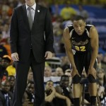 Wichita State head coach Gregg Marshall and Wichita State's Tekele Cotton watch play against Louisville during the second half of the NCAA Final Four tournament college basketball semifinal game Saturday, April 6, 2013, in Atlanta. Louisville won 72-68. (AP Photo/David J. Phillip)
