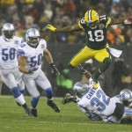 Green Bay Packers' Randall Cobb leaps over Detroit Lions' Don Carey (32) as he runs back a kick during the first half of an NFL football game Sunday, Dec. 9, 2012, in Green Bay, Wis. (AP Photo/Jeffrey Phelps)