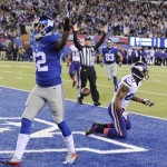 New York Giants wide receiver Rueben Randle (82) celebrates after catching a pass for a touchdown as Minnesota Vikings cornerback Chris Cook (20) and Mistral Raymond (41) react during the first half of an NFL football game Monday, Oct. 21, 2013 in East Rutherford, N.J. (AP Photo/Bill Kostroun)