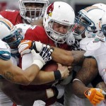 Arizona Cardinals quarterback Kevin Kolb (4) is sacked by the Miami Dolphins during the second half of an NFL football game, Sunday, Sept. 30, 2012 ,in Glendale, Ariz. The Cardinals won 24-21 in overtime. (AP Photo/Ross D. Franklin)