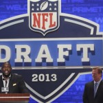 Former Tampa Bay defensive tackle Warren Sapp is joined by NFL commissioner Roger Goodell as he announces a draft pick during the second round of the NFL Draft, Friday, April 26, 2013 at Radio City Music Hall in New York. (AP Photo/Mary Altaffer)