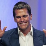 
              New England Patriots quarterback Tom Brady gestures during an event at Salem State University in Salem, Mass., Thursday, May 7, 2015. An NFL investigation has found that New England Patriots employees likely deflated footballs and that quarterback Tom Brady was "at least generally aware" of the rules violations. The 243-page report released Wednesday, May 6, 2015, said league investigators found no evidence that coach Bill Belichick and team management knew of the practice. (AP Photo/Charles Krupa, Pool)
            
