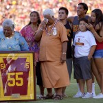 
              FILE- In this Sept. 1, 2012, file photo, family members of Junior Seau including his mother Luisa Seau, far left, and his father Tiaina Seau, third from left, stand during a ceremony to honor the former Southern California player during the first half of an NCAA college football game between Hawaii and Southern California in Los Angeles. The family of the late Junior Seau will not disrupt the Hall of Fame ceremonies on Aug. 8, 2015, despite their disagreement with a policy preventing live remarks during a posthumous induction. (AP Photo/Mark J. Terrill, File)
            