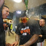 San Francisco Giants' Pablo Sandoval, center, is doused by teammates as they celebrate the Giants' 8-0 win over the Pittsburgh Pirates in the National League wild-card baseball playoff game in Pittsburgh on Wednesday, Oct. 1, 2014. (AP Photo/Gene J. Puskar)