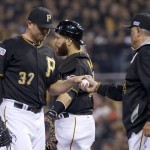 Pittsburgh Pirates relief pitcher Justin Wilson is removed by manager Clint Hurdle, right, in the sixth inning the NL wild-card playoff baseball game against the San Francisco Giants on Wednesday, Oct. 1, 2014, in Pittsburgh. (AP Photo/Gene J. Puskar)