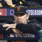 San Francisco Giants manager Bruce Bochy watches his team play the Pittsburgh Pirates in the seventh inning of the NL wild-card playoff baseball game Wednesday, Oct. 1, 2014, in Pittsburgh. (AP Photo/Gene J. Puskar)
