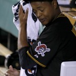 Pittsburgh Pirates starting pitcher Edinson Volquez wipes his face after being taken out of the NL wild-card playoff baseball game against the San Francisco Giants in the sixth inning Wednesday, Oct. 1, 2014, in Pittsburgh. (AP Photo/Gene J. Puskar)