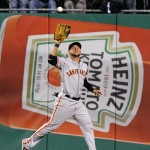 San Francisco Giants center fielder Gregor Blanco catches a fly ball hit by Pittsburgh Pirates' Gaby Sanchez in the fifth inning of the NL wild-card playoff baseball game Wednesday, Oct. 1, 2014, in Pittsburgh. (AP Photo/Don Wright)