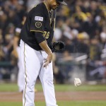 Pittsburgh Pirates starting pitcher Edinson Volquez throws down a rosin bag after giving up a grand slam to San Francisco Giants' Brandon Crawford in the fourth inning the NL wild-card playoff baseball game Wednesday, Oct. 1, 2014, in Pittsburgh. (AP Photo/Gene J. Puskar)