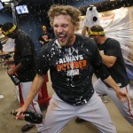 San Francisco Giants' Hunter Pence begins to celebrate after the Giants defeated the Pittsburgh Pirates 8-0 in the NL wild-card playoff baseball game in Pittsburgh on Wednesday, Oct. 1, 2014. The Giants move on to face the Washington Nationals in a National League Division Series. (AP Photo/Gene J. Puskar)