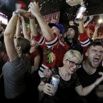
              Chicago Blackhawks fans celebrate the Wrigleyville neighborhood of Chicago after the Blackhawks defeated the Tampa Bay Lightning to win the NHL hockey Stanley Cup on Monday, June 15, 2015, in Chicago. (AP Photo/Christian K. Lee)
            