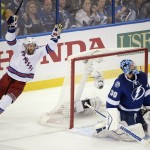 
              New York Rangers center Dominic Moore, left, celebrates after defenseman Keith Yandle scored a goal against Tampa Bay Lightning goalie Ben Bishop (30) during the second period of Game 4 of the Eastern Conference finals in the NHL hockey Stanley Cup playoffs, Friday, May 22, 2015, in Tampa, Fla. (AP Photo/Phelan M. Ebenhack)
            