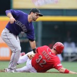 
              Colorado Rockies' shortstop Daniel Descalso (3) tags out Cincinnati Reds' Jay Bruce (32) as Bruce attempts to steal second base during the first inning of their baseball game Monday, May 25, 2015, in Cincinnati. (AP Photo/Gary Landers)
            